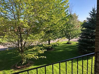 The unit has a personal patio which overlooks the landscaped front yard.
