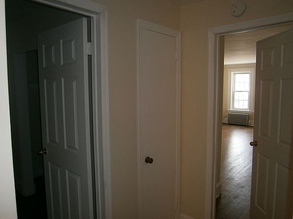 Foyer to bedrooms with linen closet.