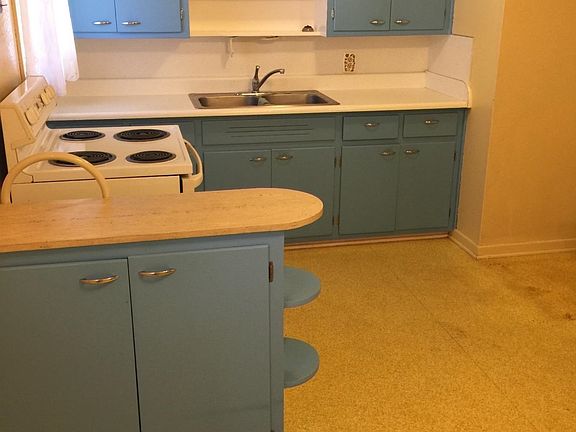 Clean and spacious eat in kitchen.  So roomy and light!