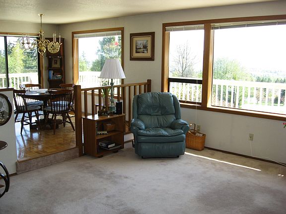 Patio door off the dining area leads to the wraparound deck.