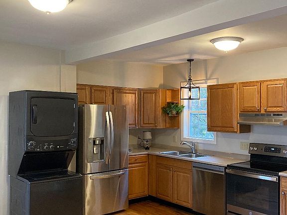 Large Kitchen with new oven, ventilation hood, dishwasher, fridge, washer and dryer.