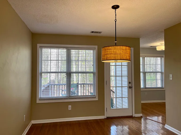 View from the Dining room overlooking the back deck and backyard. Dining room leads into the breakfast nook area.