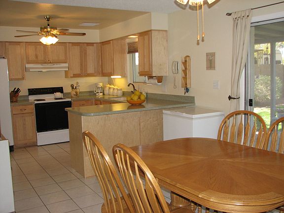 The dining area flows into the kitchen