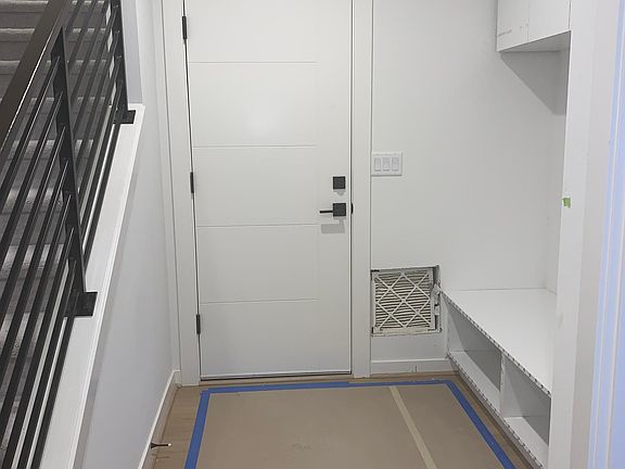 Entrance from garage. Across is the front door.