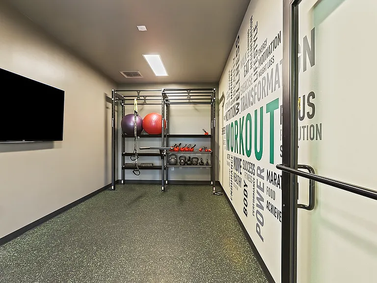 Elevate your health in this sleek and motivational home workout room.