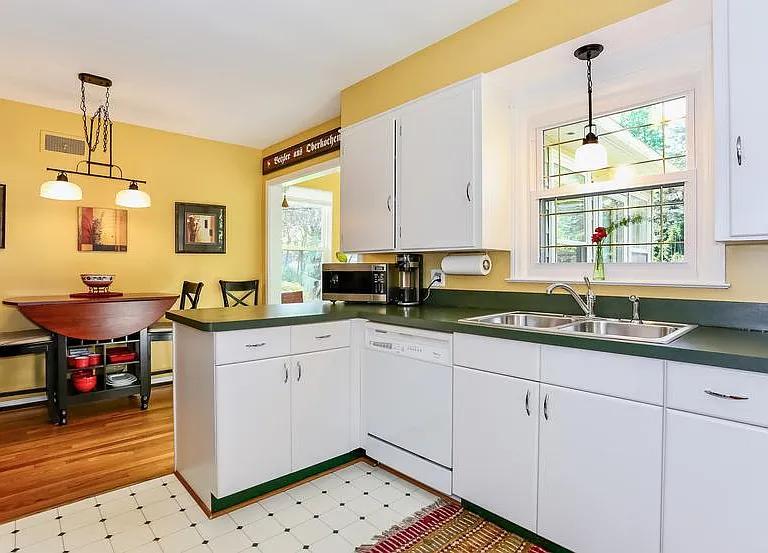 The convenient and well-equipped kitchen with a great view overlooking the spacious backyard.