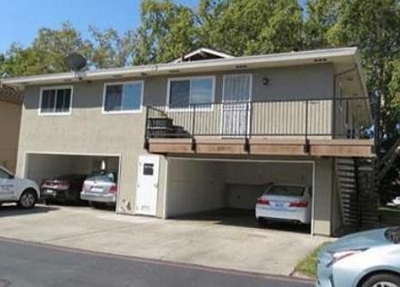 Back Side: 2 parking spaces & 2 Storage