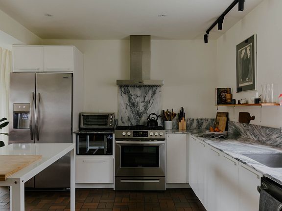 Open kitchen with marble countertops
