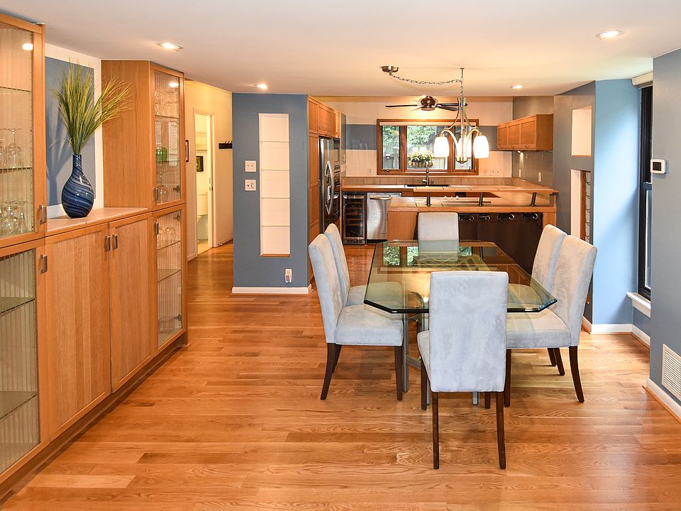 Hard wood floors throughout. Gorgeous dining table seating 6. Beautiful glassware enclosed with extra space for your special items! View into kitchen with bar. Dimmable recessed lights. Contemporary & spotless!