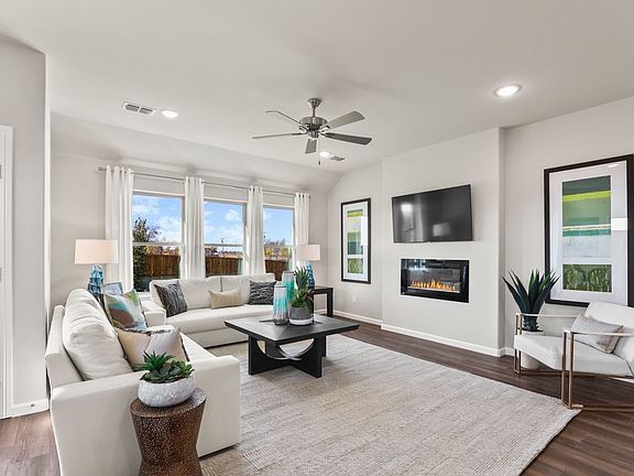 Living room in the Heisman home plan by Trophy Signature Homes - REPRESENTATIVE PHOTO