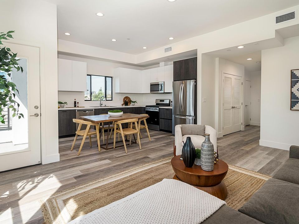 living/dining/kitchen/balcony and front entry hall