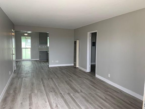 Living Room looking into kitchen and hallway