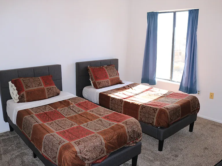 second bedroom has two single beds with memory foam
