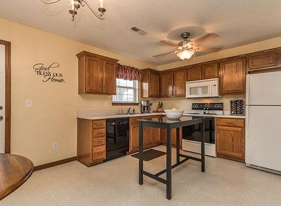 There is plenty of room in this kitchen for a larger table, or pull up two more bar stools to the center island table.  Sellers will leave the island, refrigerator, dishwasher, stove and microwave.