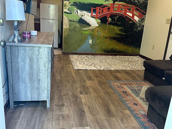 Living area -10' tall ceilings add to an open feeling that is flooded by natural light. Shared with space for small table, a desk. This is the brand new floor