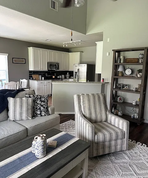 Living room opens to kitchen area.