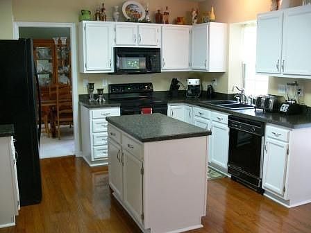 New counters and matching sinks, Black GE Profile Appliances, Refin. Floor