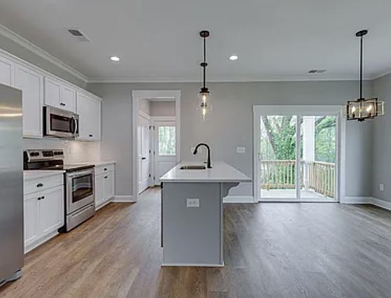 Kitchen opens to dining area. Perfect for hosting.