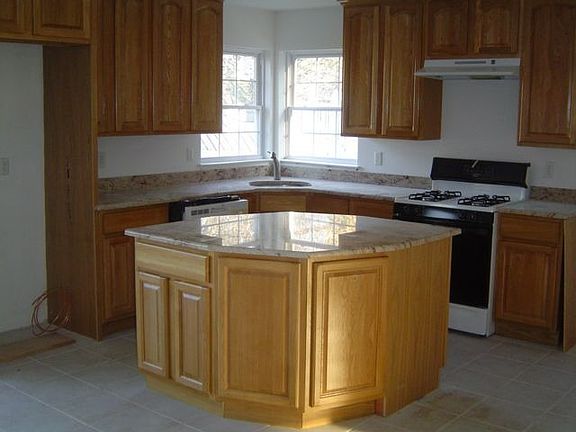 eat in kitchen with island and granite counter tops