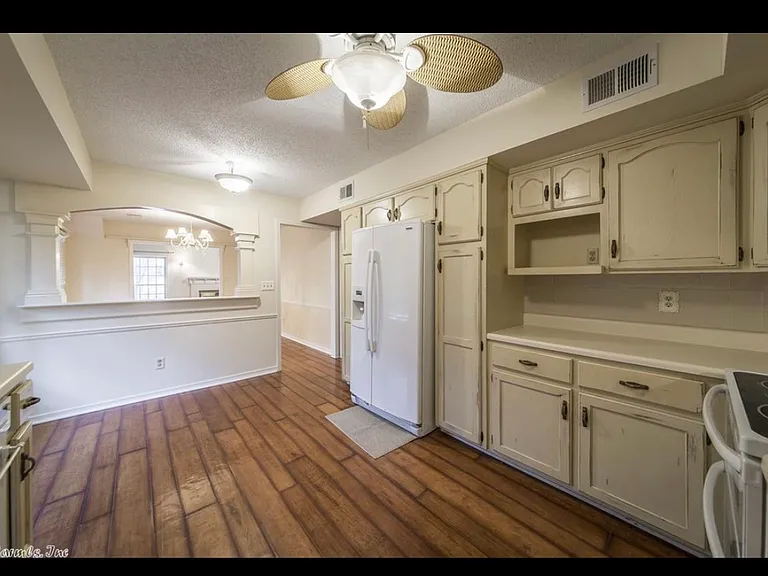 Kitchen looking into cutout to dining room