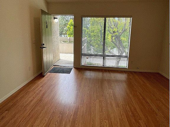 View of the living space and windows from the kitchen.
