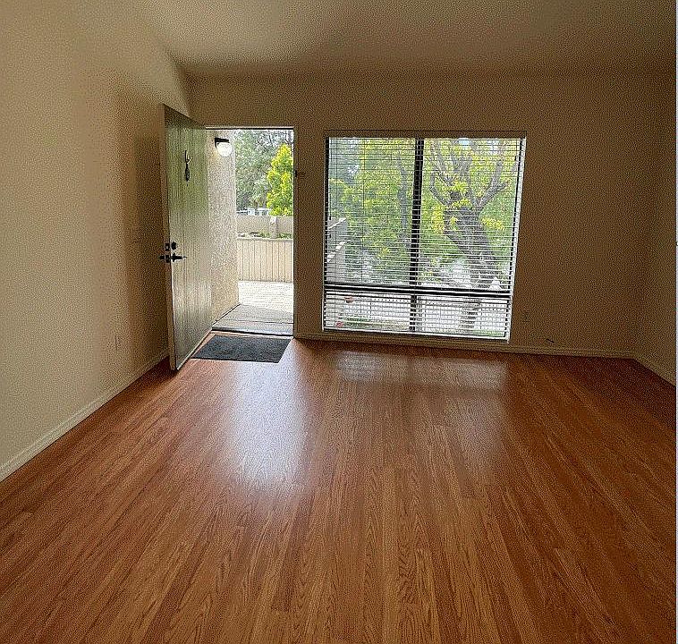 View of the living space and windows from the kitchen.