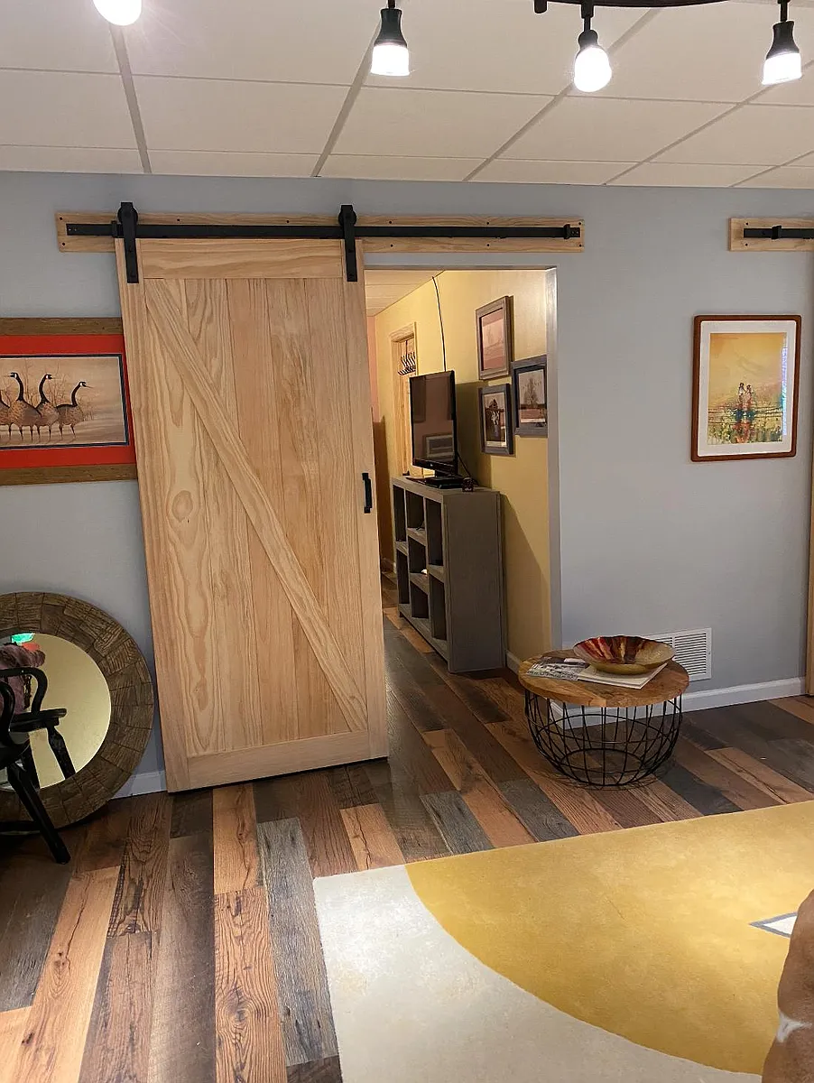 Barn doors provide the bedroom and laundry area with privacy. - 773 Garden Heights Dr