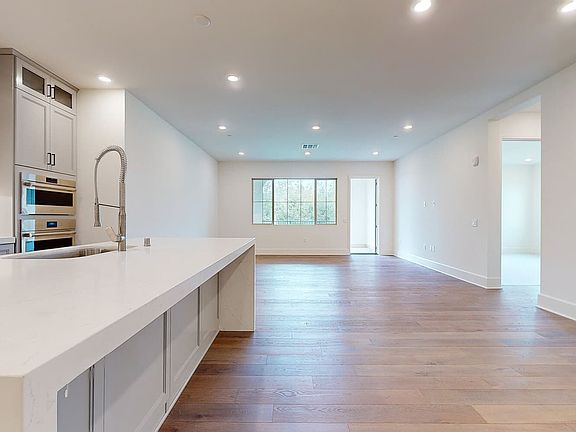 This photo shows the kitchen and dining space in Unit 330, Homesite 11 at Villas.