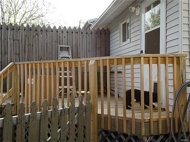 Private deck with rear entrance to home.