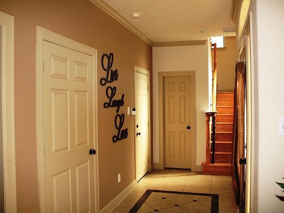 Cheery Entry Hall that greets family and guests with warmth. There is a elevat