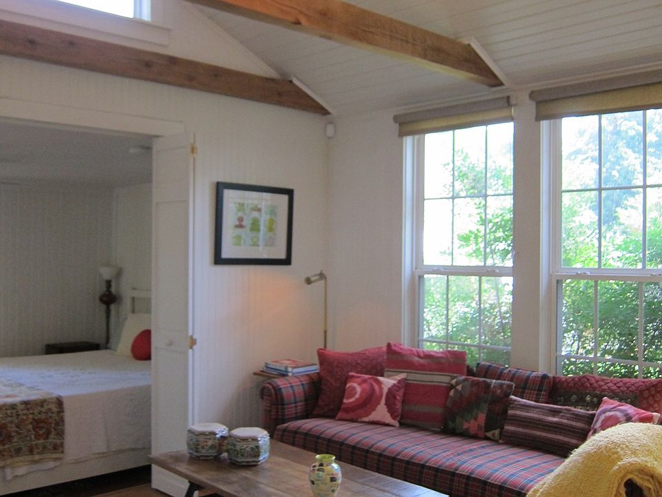Vaulted ceiling with beams and fan