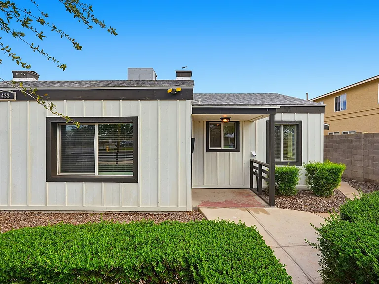 Private entrance with adorable well maintained landscaped walk way leading to the unit.