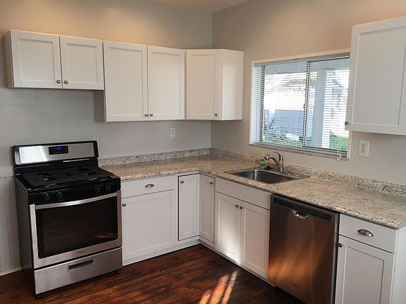 Kitchen with gas stove and dishwasher.