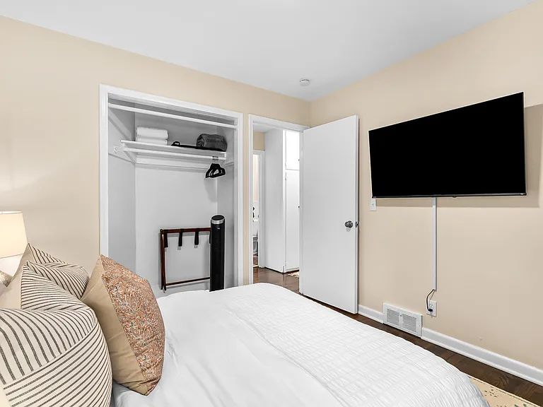 This spacious bedroom has enough space for everyone to relax and unwind.