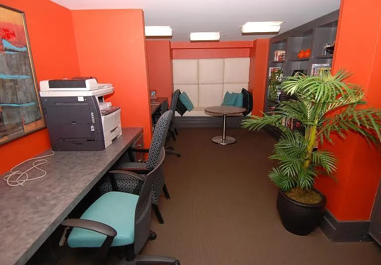 Business Center with Workstations and Seating Area