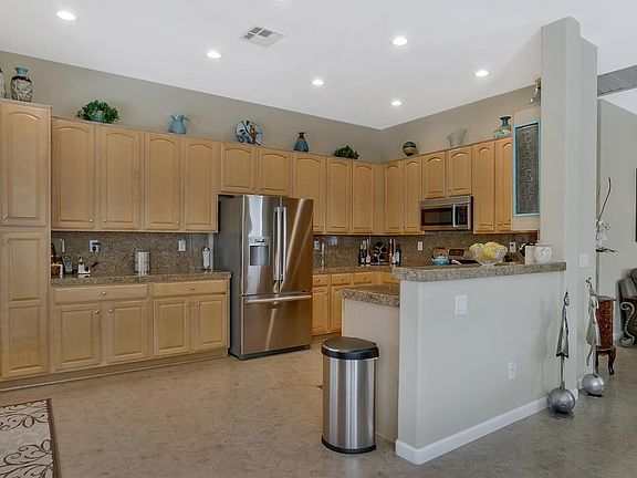 Spacious kitchen with PLENTY of storage, granite countertops, and stainless steel appliances. VERY CLEAN!