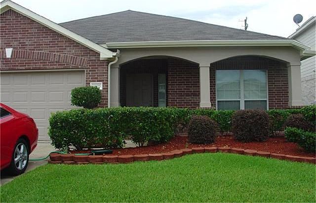 Front of home with beautiful landscaping