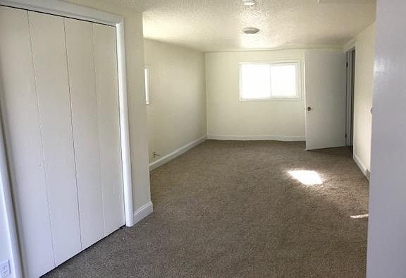 Large master with lots of light and closet space. French doors lead out to private patio.