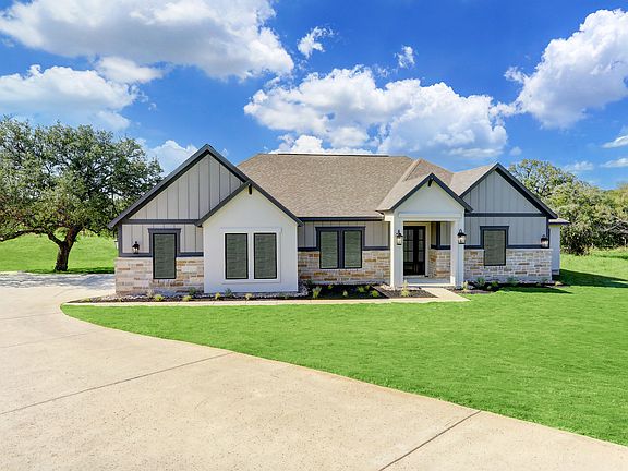 This home is brimming with hill country charm and curb appeal.