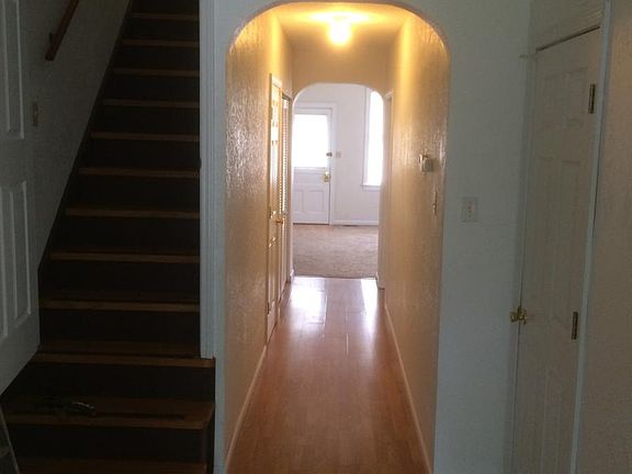 Hallway from kitchen to lower bedroom, laundry and living ro