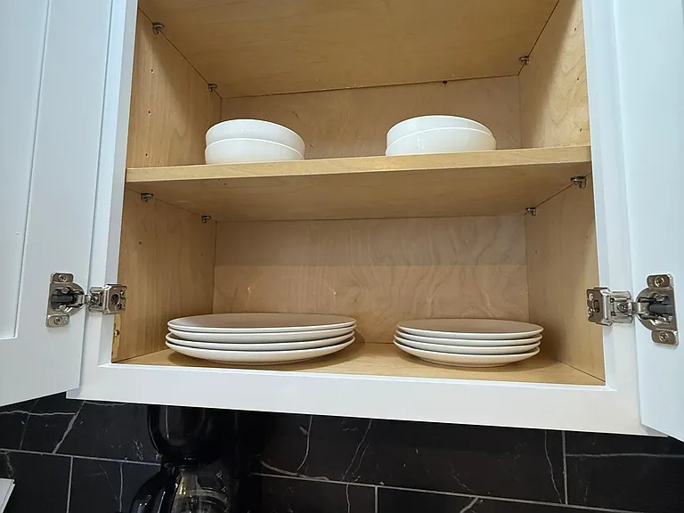 One cabinet includes deep and flat plates for your use.