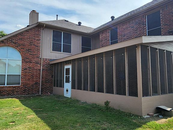 Backyard with covered patio sunroom