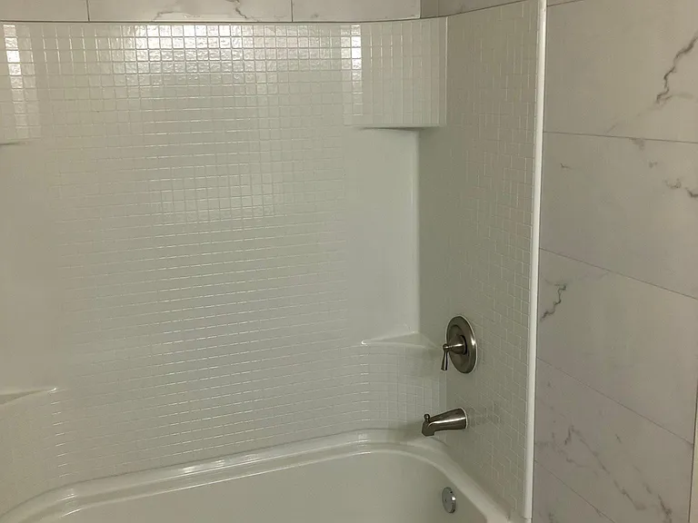 Remodeled Bathroom with Brand New Tile Walls, Floors, and Bathtub (July 2022)