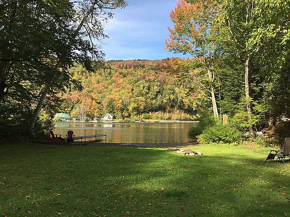 Gently sloping lawn to lake