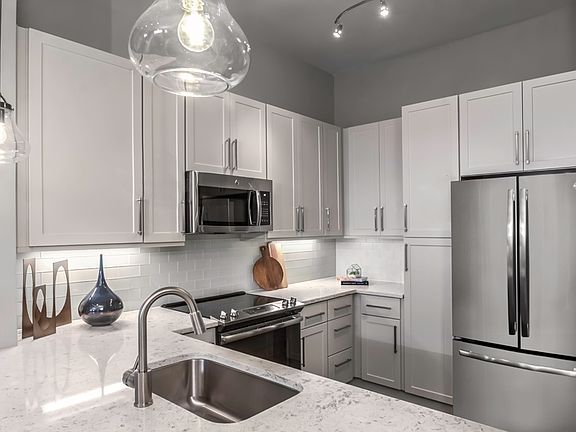 Premium quartz countertops with subway tile backsplash