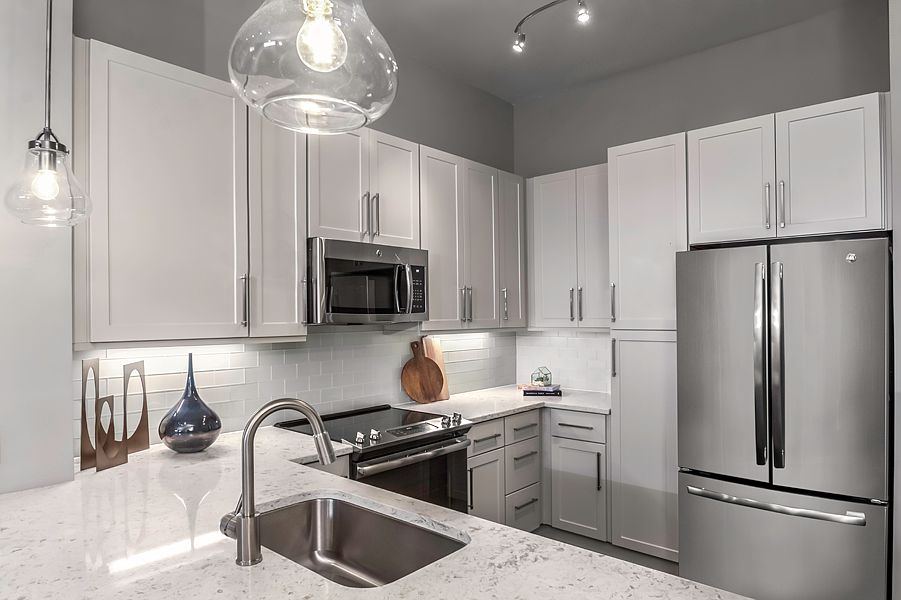 Premium quartz countertops with subway tile backsplash