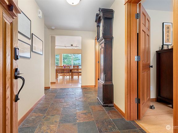 Elegant slate floor entry, note all the natural wood doors and trim.>