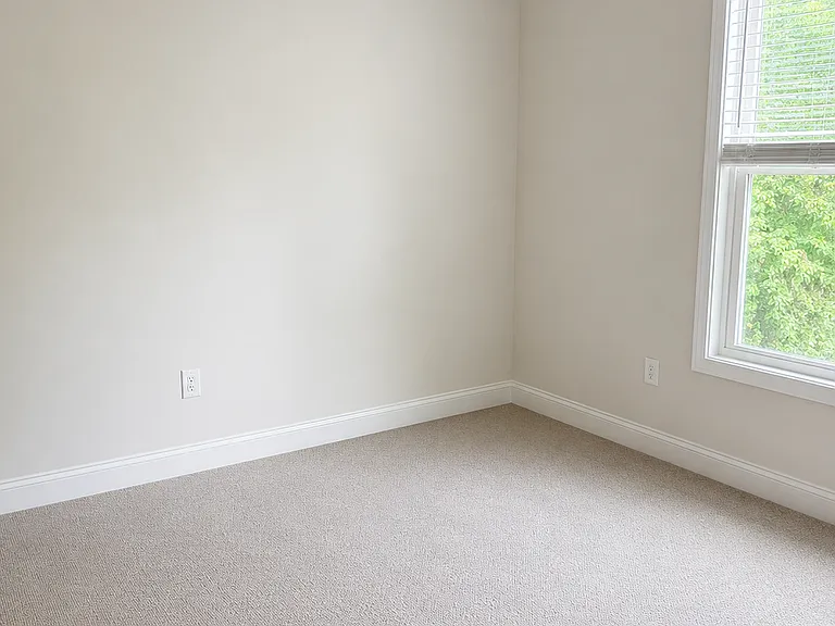 Secondary bedroom with full bathroom and ceiling fan. Room currently furnished, but will be cleared out before move-in.