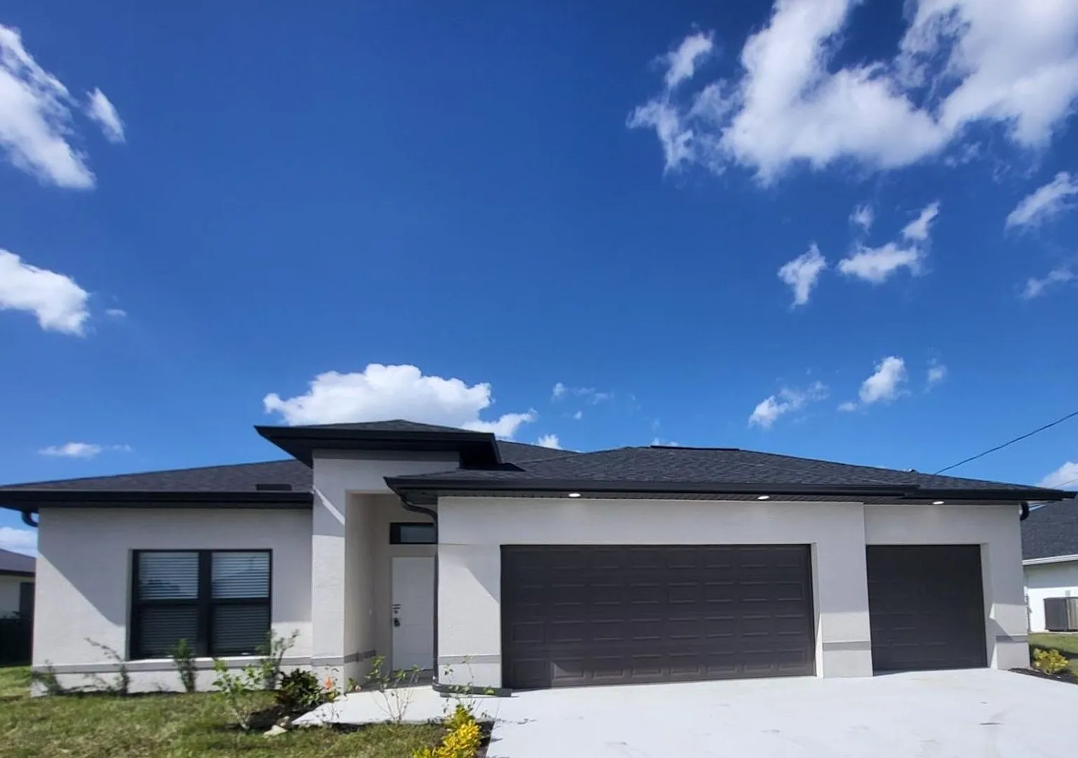 Brand-New Luxury Home with 3-Car Garage & Lawn Care Included | Modern Living in Cape Coral! — Photo 1