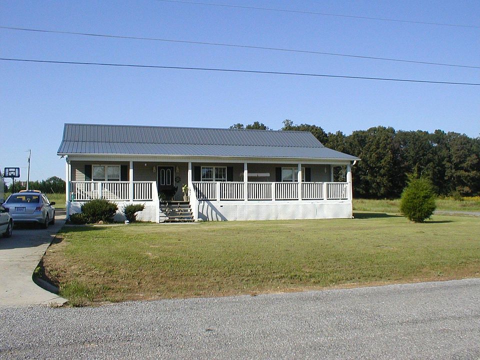 Be Welcomed By the Large Porch...